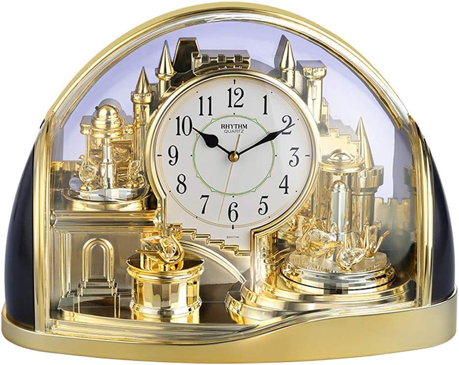 Rhythm gold and black mantel clock with rotating crystal pendulums