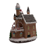 30cm battery-operated LED gingerbread house with rotating characters