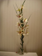 Artificial grass and lilies in spiral vase 70cm