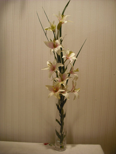 GRASS AND LILLIES IN SPIRAL VASE