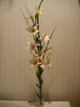 Artificial grass and lilies in spiral vase 70cm