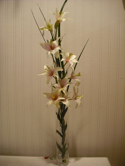 GRASS AND LILLIES IN SPIRAL VASE