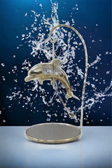 Gold-plated dolphin ornament with crystal detail and mirrored stand