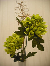 Green artificial flower arrangement in white vase – 53cm