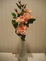 White artificial camellia flower arrangement in vase