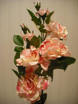 White artificial camellia flower arrangement in vase