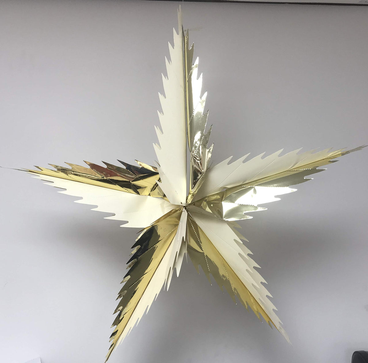 Cream and gold spiky star foil Christmas ceiling decoration
