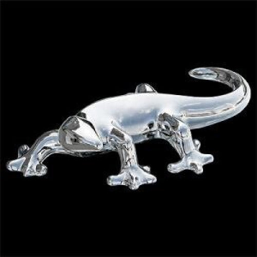 Silver ceramic gecko sculpture on black background