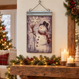 Frosty snowman metal wall hanging in a festive mantel display