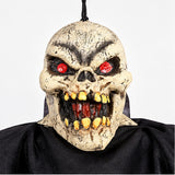 Hanging Ghoul Halloween rubber skull mask with red eyes and yellow teeth close up