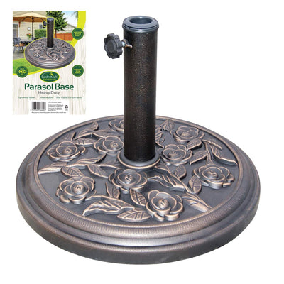 A heavy-duty, round parasol base with a floral design, featuring embossed roses and leaves. The base has a central tube with an adjustable knob for securing the parasol. In the background, the product packaging shows a picture of this parasol base in use.