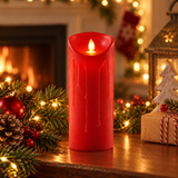 Premier red 23cm LED dancing flame candle in a festive fireplace display