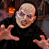 Putrid hooded zombie horror mask worn for spooky Halloween fancy dress