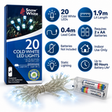 Snow White cold white battery LED fairy lights in a festive mantel display