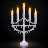 Close-up of white five-candle flickering LED Christmas candelabra