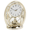 Rhythm gold oval mantel clock with rotating shooting-star pendulum