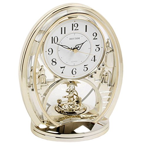 Rhythm gold oval mantel clock with rotating shooting-star pendulum