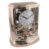 Rhythm rose gold musical mantel clock with rotating pendulum