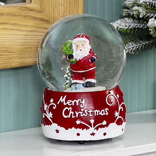 Traditional Santa snow globe playing We Wish You a Merry Christmas