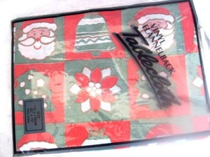 52 inches by 70 inches RED & GREEN SANTA N BELLS FLANNEL BACK WIPE-CLEAN VINYL XMAS TABLECLOTH