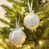 White and gold Christmas baubles with snowflake and icicle designs