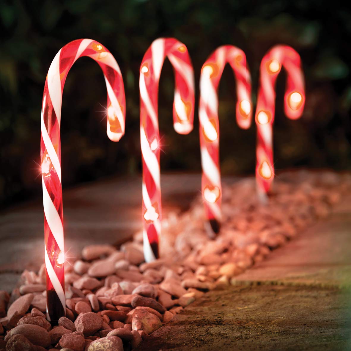 Set of four red and white LED candy cane Christmas path lights
