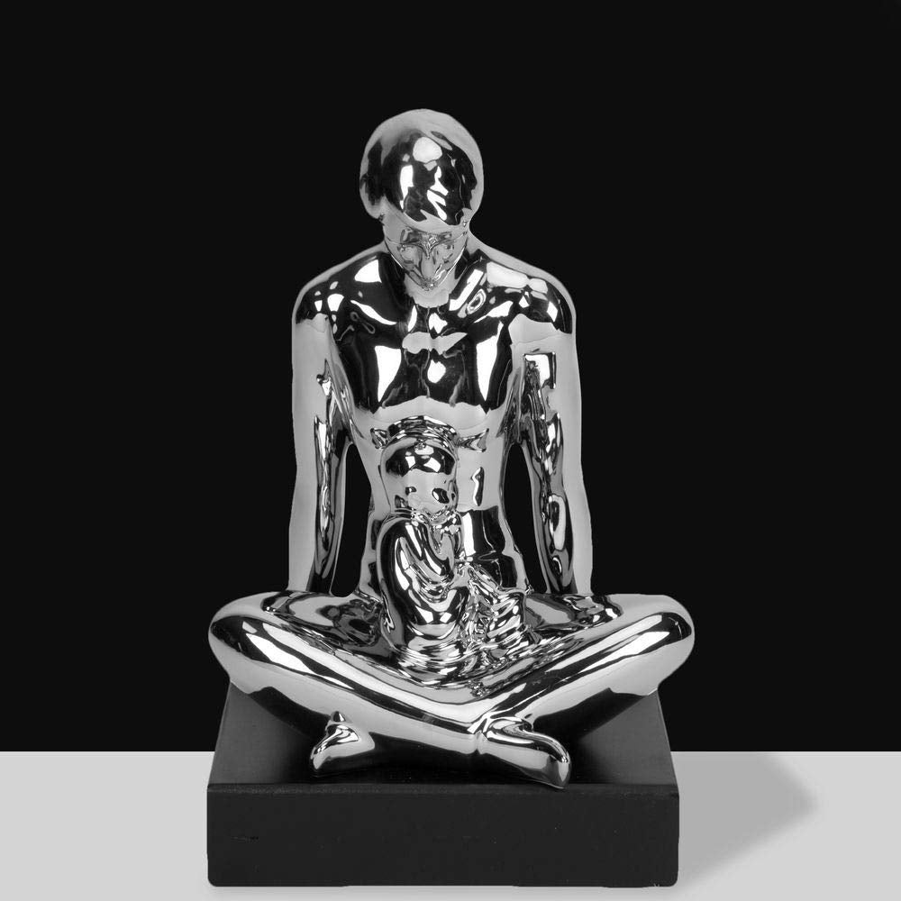 Silver ceramic cross-legged man with child figurine
