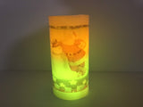 Flameless Santa Christmas pillar candle illuminated