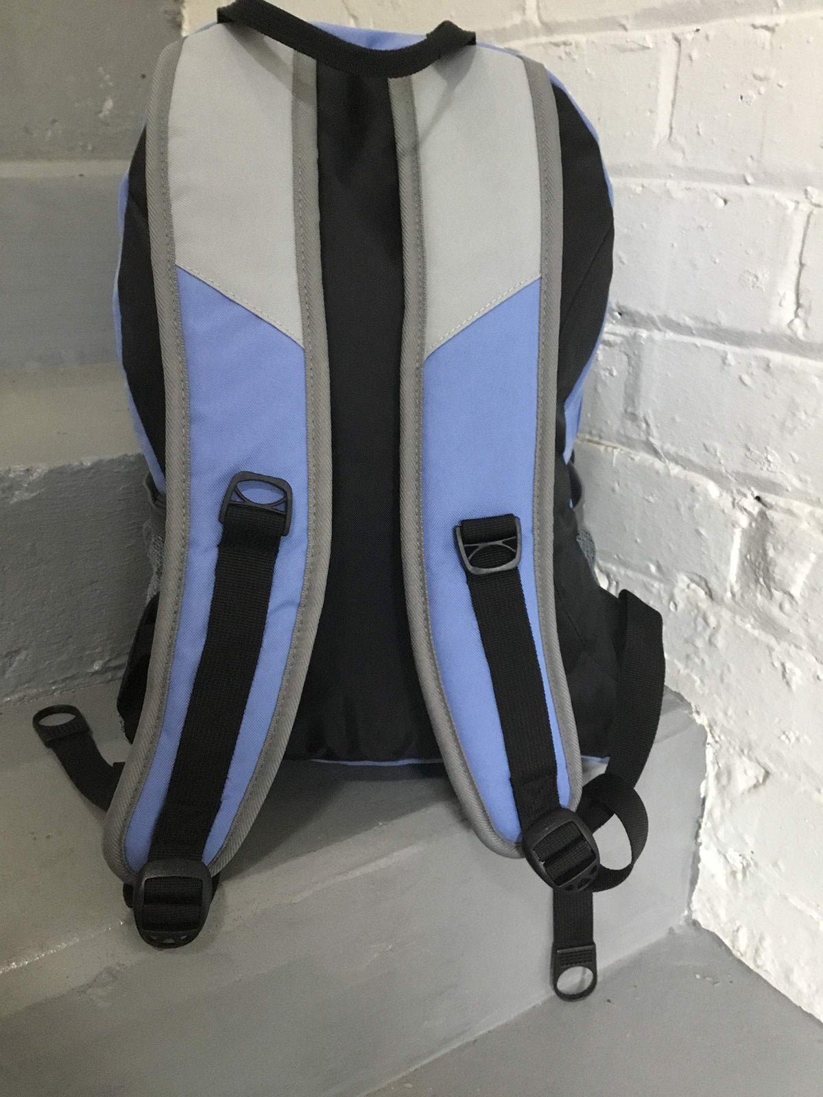 Backpack with front pocket and mesh side pockets